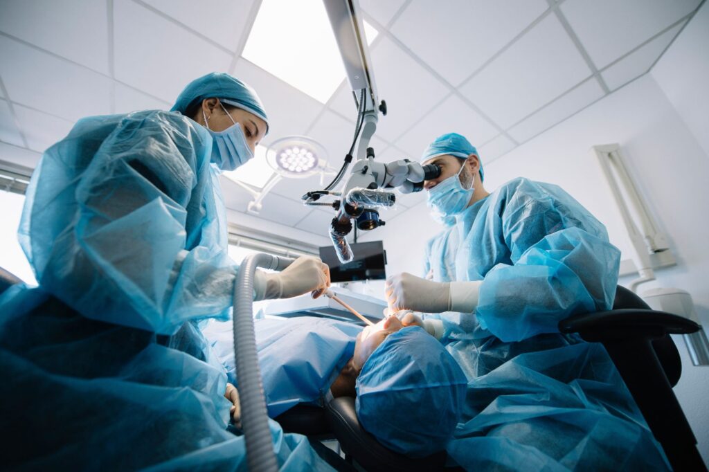 a periodontal expert performing oral surgery