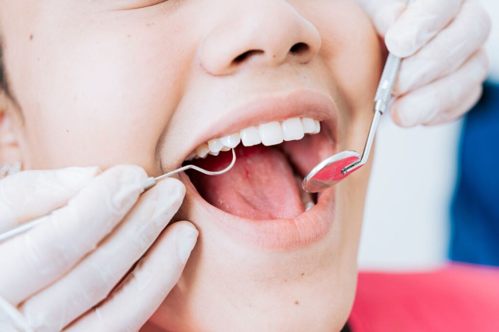 a periodontist treating a dental patient