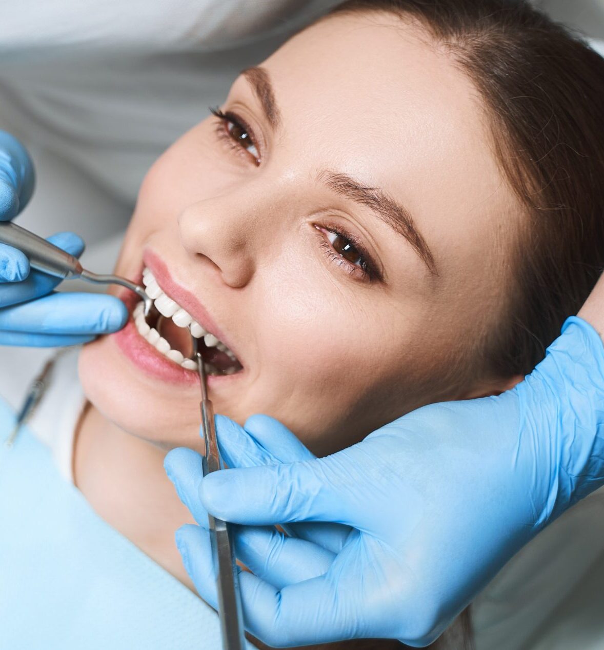 Pretty woman is staying in dental clinic stock photo